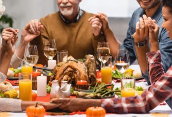 Family holding hands on thanksgiving