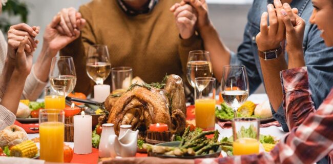 Family holding hands on thanksgiving